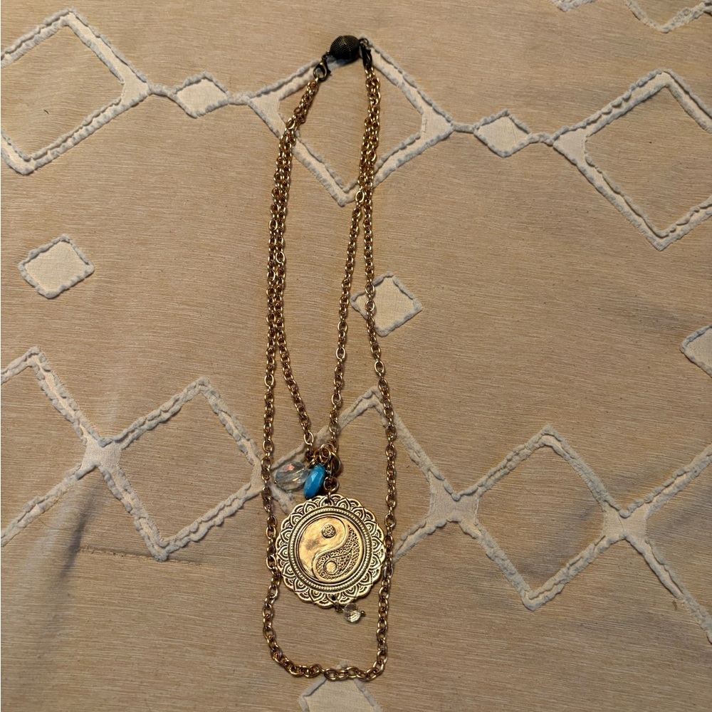 Gold-Tone Yin Yang Pendant Necklace with Blue Accent Bead